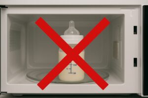 A visual warning showing a microwave oven with a baby bottle inside, overlaid with a bold red 'X' or 'NO MICROWAVE' symbol, emphasizing unsafe warming.