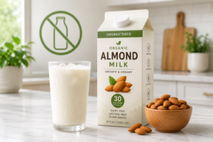 A fresh glass of lactose-free almond milk on a bright kitchen counter.