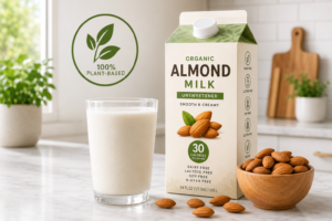 A fresh glass of non-dairy almond milk on a bright kitchen counter.