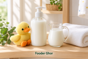A pump bottle of gentle baby cleanser resting on a wooden bath shelf representing the best organic goat milk body wash for babies by Fooder Ghor.